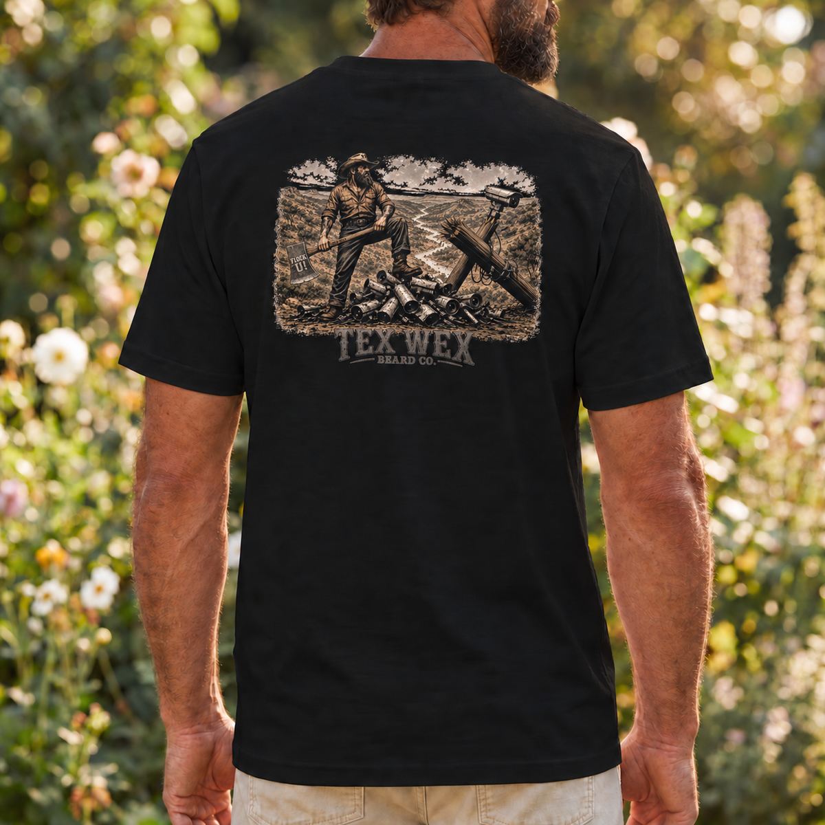 Tex Wex Beard Co. Nobody's Business Tee - back graphic, bearded Texan clearing surveillance cameras in the Texas Hill Country